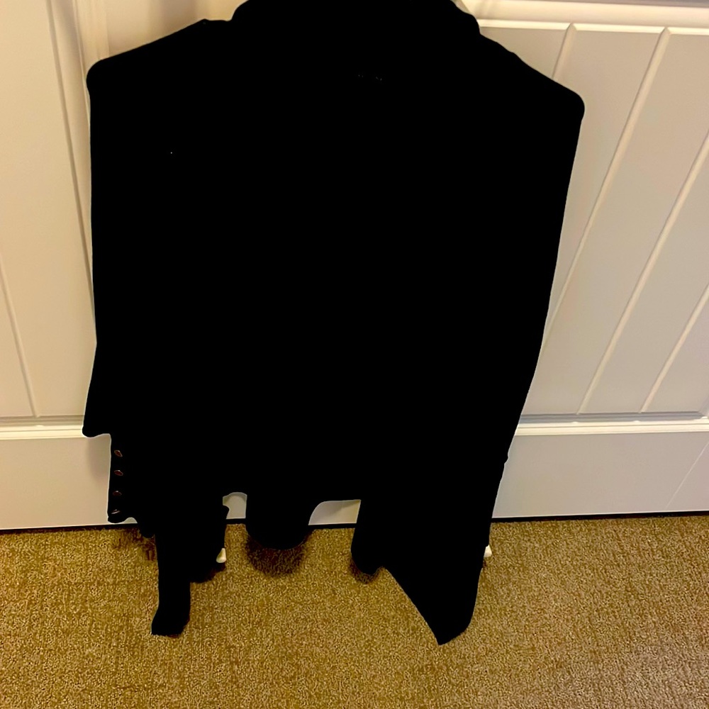 This is a black poncho turtle neck sweater. It is Large and never been worn.